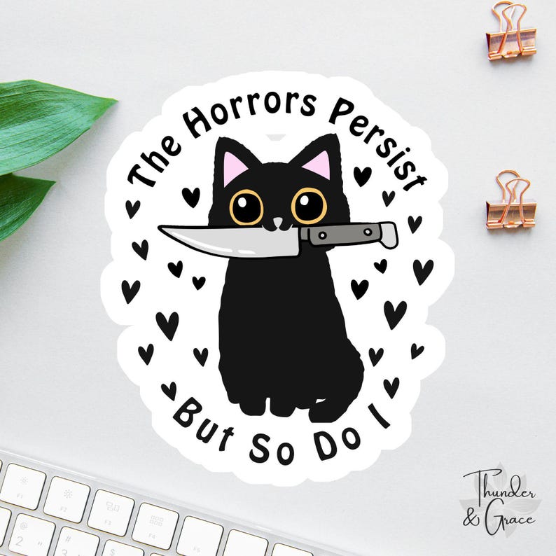 il_794xN.7087397674_ovds.jpg The Horrors Persist But So Do I Cat Sticker - Image 1