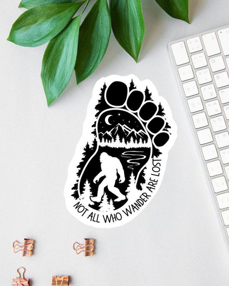 il_794xN.7135312085_6chl.jpg Not All Who Wander Bigfoot Sticker - Image 1